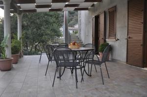 a table and chairs sitting on a patio at Santa Maria in Cittadella del Capo
