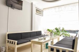 a living room with a couch and a table at SeaSala Hotel in Vung Tau
