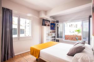 Posteľ alebo postele v izbe v ubytovaní Ten Hostel