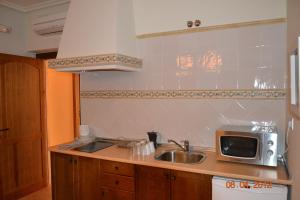 Kuchyň nebo kuchyňský kout v ubytování Apartamentos Rurales Natura