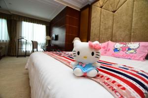 Postel nebo postele na pokoji v ubytování Xijiao State Guest Hotel