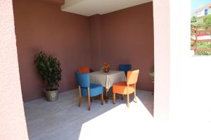a dining room with a table and chairs at Apartment Nijona in Trebinje