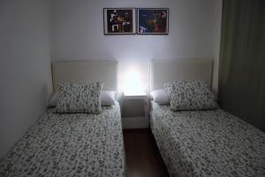 Apartamento Serranos CMにあるベッド
