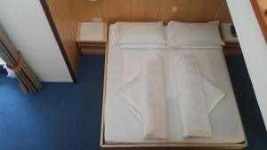 Postel nebo postele na pokoji v ubytování Hotel Brandl