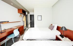 Letto o letti in una camera di Seoul Hotel ShinShin Myeongdong