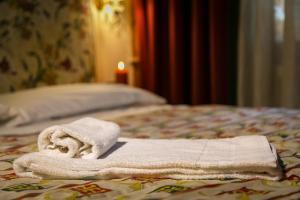 Posteľ alebo postele v izbe v ubytovaní Hotel Posta R.T.A.