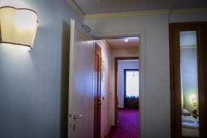 Posteľ alebo postele v izbe v ubytovaní Hotel Posta R.T.A.