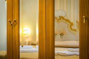 Posteľ alebo postele v izbe v ubytovaní Hotel Posta R.T.A.