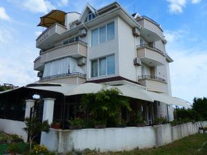 a tall building with a porch in front of it at Studio S - Vasiliko in Tsarevo +9 photos