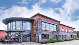a large brick building with a round roof at vevio - Hotel & Events in Spiesen-Elversberg