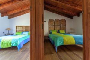 Ліжко або ліжка в номері Finca Montemateo