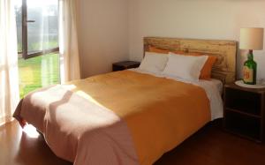 a bedroom with a bed and a large window at Moleiro's Country House in Esposende +36 photos