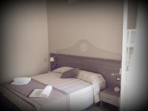 Postel nebo postele na pokoji v ubytování Hotel I Pini