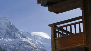a view of a snowy mountain from a cabin balcony at LES 3 CIMES BLANCHES in Chamonix