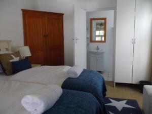 Postel nebo postele na pokoji v ubytování Breeze Inn Guesthouse