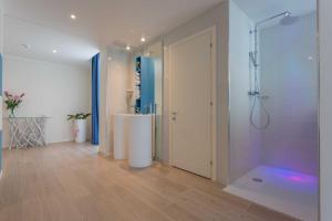 a bathroom with a shower and a sink and a shower at Hotel Mediterraneo in Sottomarina