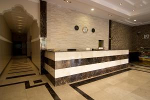 a lobby with a reception counter in a building at Shaza Al Khamis شذا الخميس in Khamis Mushayt