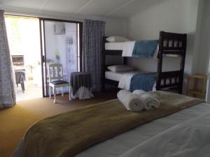 Postel nebo postele na pokoji v ubytování Breeze Inn Guesthouse
