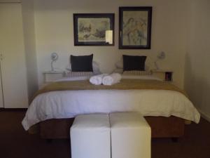 Postel nebo postele na pokoji v ubytování Breeze Inn Guesthouse