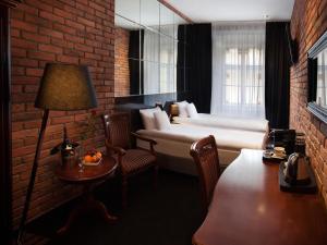 Posteľ alebo postele v izbe v ubytovaní Hotel Betmanowska Main Square Residence Adults Only
