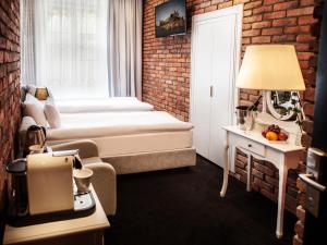 Posteľ alebo postele v izbe v ubytovaní Hotel Betmanowska Main Square Residence Adults Only