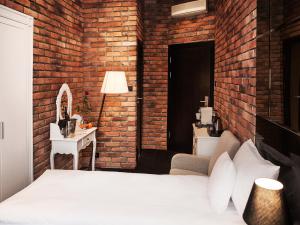 Posteľ alebo postele v izbe v ubytovaní Hotel Betmanowska Main Square Residence Adults Only