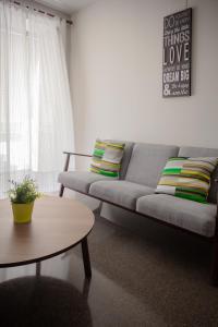 a living room with a couch and a table at Hostal El Convent de Moncada in Moncada