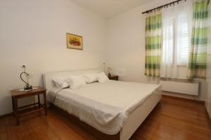 Postel nebo postele na pokoji v ubytování Apartment Pijer