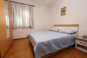 Postel nebo postele na pokoji v ubytování Apartment Pijer