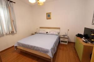 Postel nebo postele na pokoji v ubytování Apartment Pijer