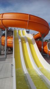 a row of slides in a water park at Camping le Royon in Fort-Mahon-Plage
