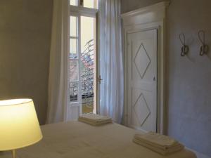 A bed or beds in a room at Le Porte di Marzo