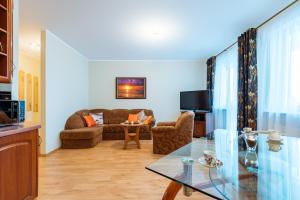 Televízia a/alebo spoločenská miestnosť v ubytovaní Apartament Morski