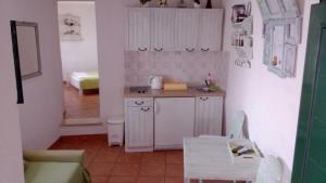Kuchyňa alebo kuchynka v ubytovaní Apartments Ivica Mateljak