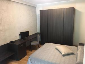 Voodi või voodid majutusasutuse Hotel Maloia toas