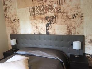 Voodi või voodid majutusasutuse Hotel Maloia toas