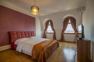 מיטה או מיטות בחדר ב-Purple Star Apartments