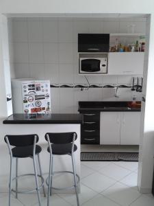Una cocina o zona de cocina en Apartamento Praia Grande Ocian