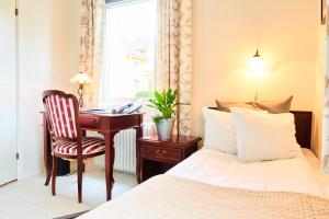 Ένα ή περισσότερα κρεβάτια σε δωμάτιο στο Hotell Björkhaga