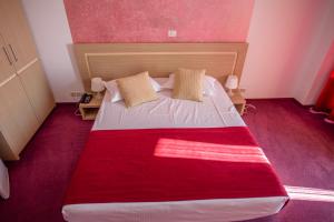 Кровать или кровати в номере Hotel Vis
