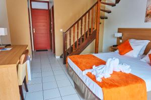 Postel nebo postele na pokoji v ubytování The Originals City, Hôtel Belova, Cayenne Sud