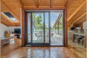an open living room with sliding glass doors at Apartments Tamar in Jelsa +22 photos