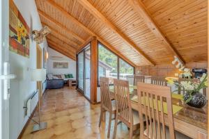 a dining room and living room with a table and chairs at Apartments Tamar in Jelsa