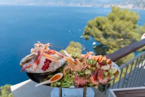 a plate of food on a table at Stella Maris Resort in Camogli