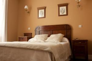 Кровать или кровати в номере Posada El Marqués De Trancadorio