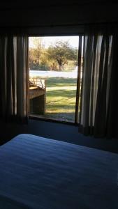 Ένα ή περισσότερα κρεβάτια σε δωμάτιο στο Cabañas Las Victorias