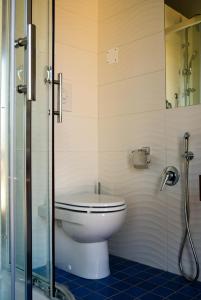a bathroom with a toilet and a glass shower at Terrazza Marconi in Salerno