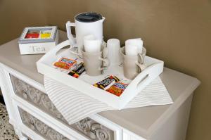 a white table with snacks and drinks on it at Affittacamere "Angel 2" in La Spezia