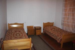 Ένα ή περισσότερα κρεβάτια σε δωμάτιο στο Firuza Hostel