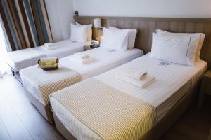 Postel nebo postele na pokoji v ubytování Piraeus Port Hotel